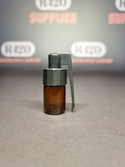 Kleine glazen injectieflacon met schroefdop en lepel